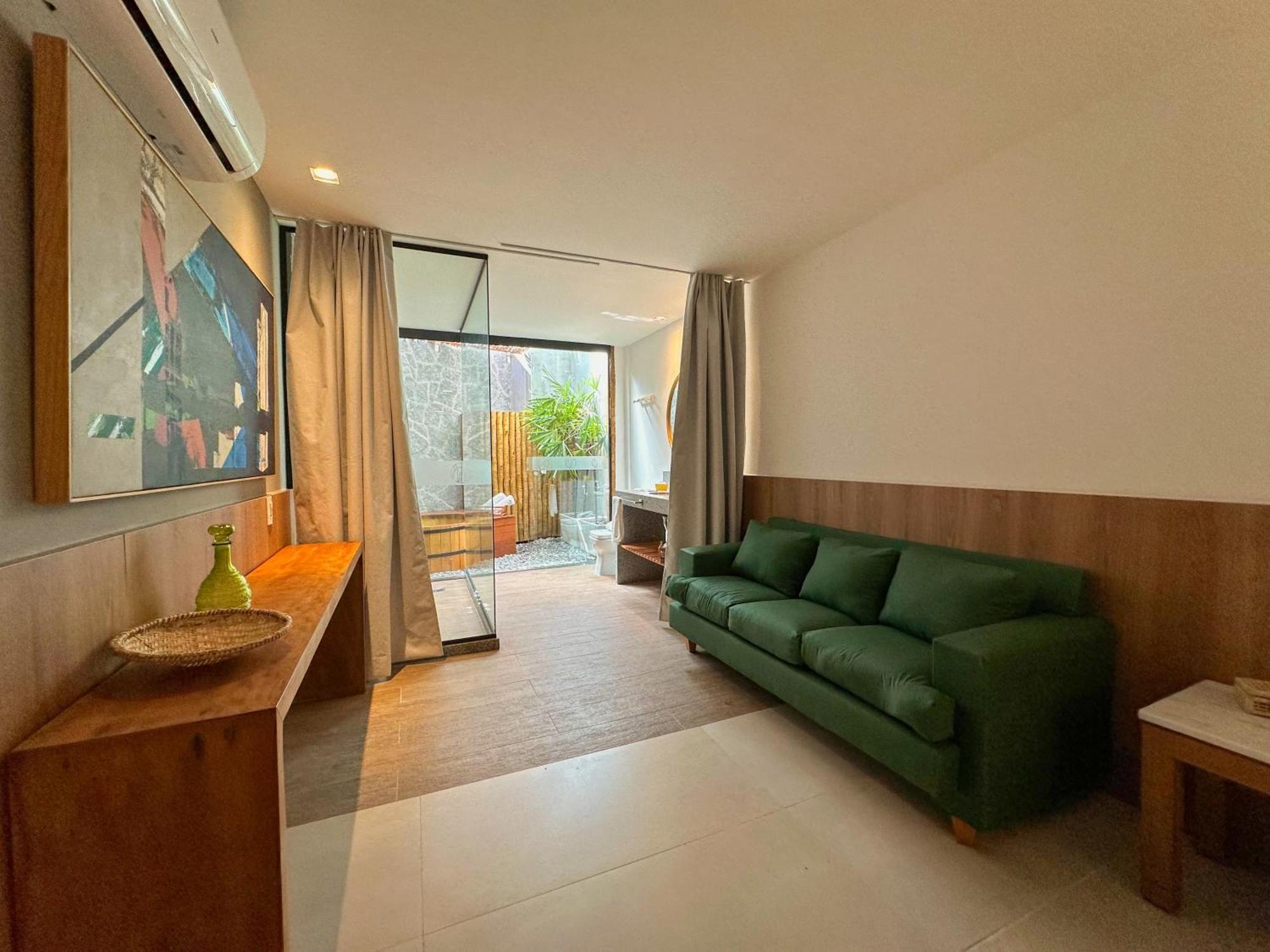 Passagem Concept Hotel e Spa Cabo Frio Esterno foto A living room in a micro apartment in Beijing, China